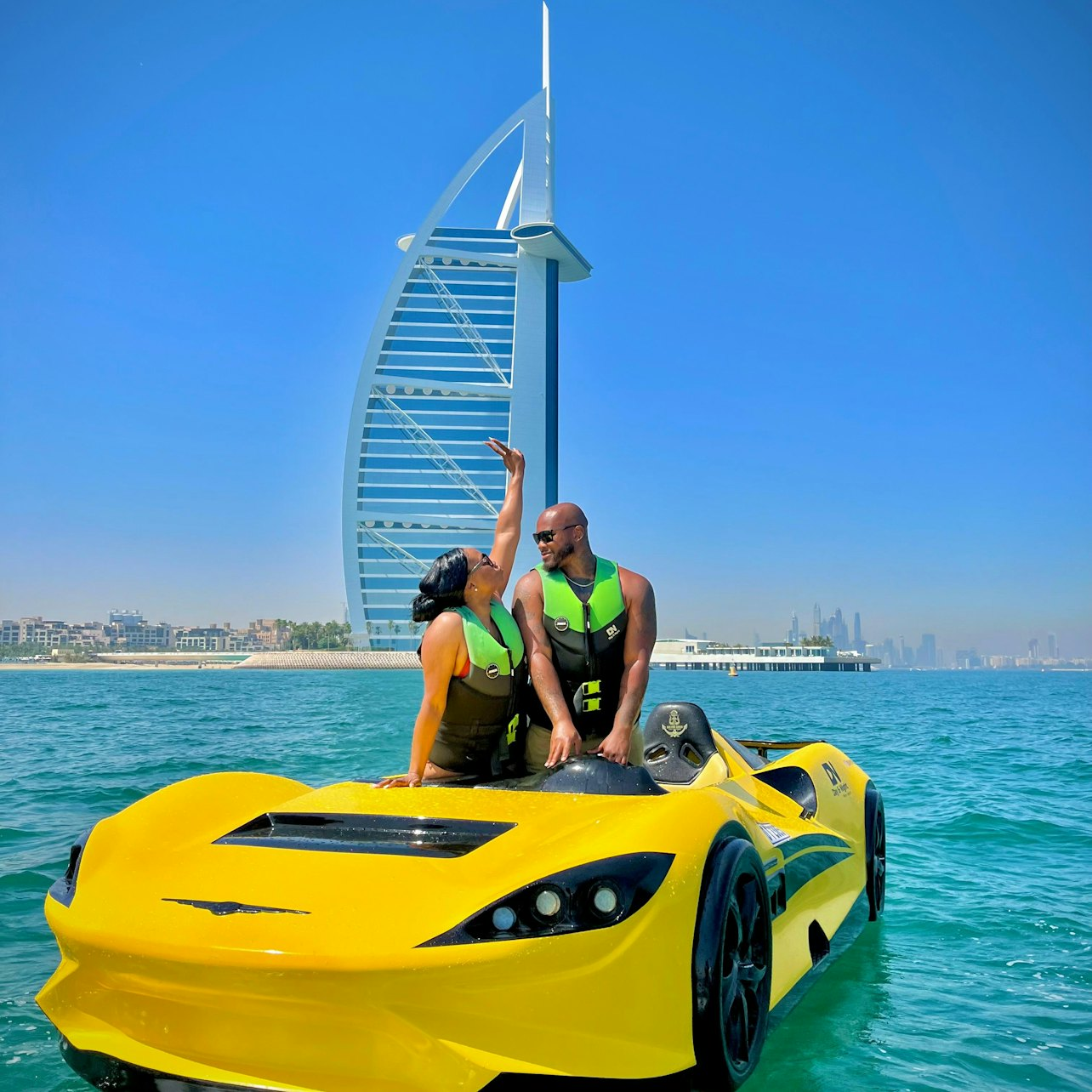 Experience the excitement of racing a jet car on the turquoise waters of Dubai with the iconic Burj Al Arab as your stunning backdrop. Unforgettable moments await!